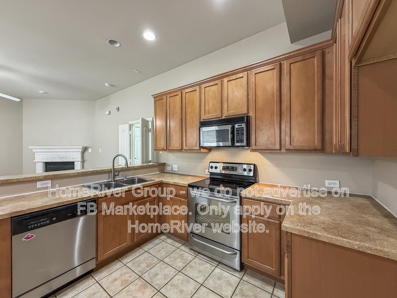 4 BR Home | Lantana Golf Course | Fireplace property image