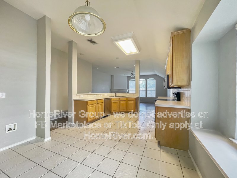 Spacious Livingroom with gas fireplace, large fenced backyard! property image