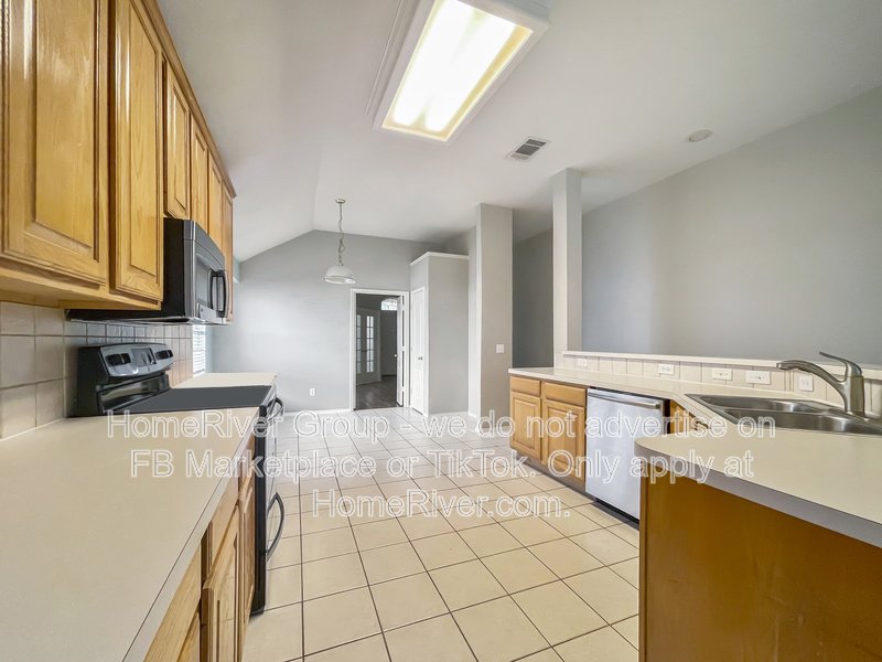 Spacious Livingroom with gas fireplace, large fenced backyard! property image