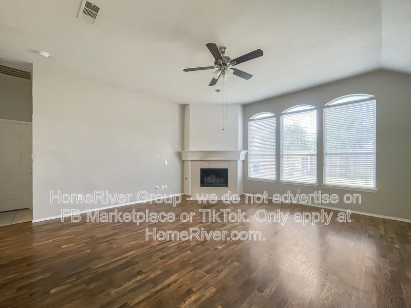 Spacious Livingroom with gas fireplace, large fenced backyard! property image